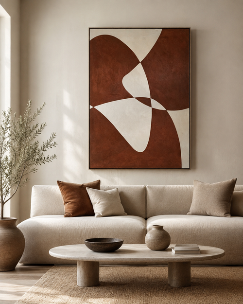 Large abstract terracotta canvas above cream boucle sofa in warm minimalist living room