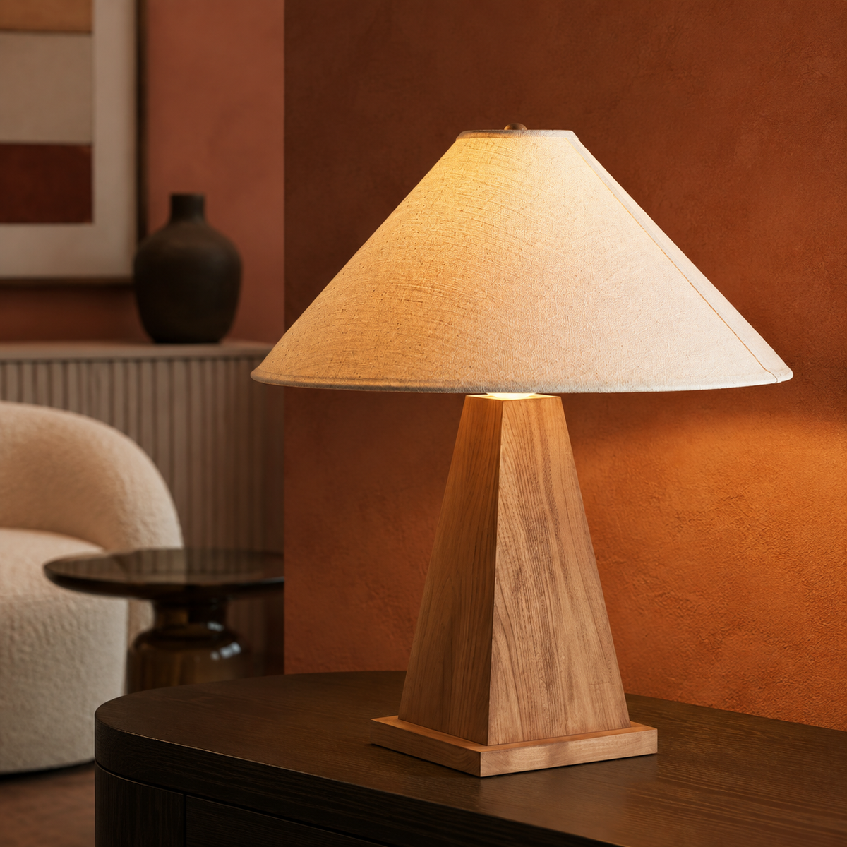 Pyramid wood lamp on dark sideboard in terracotta nook